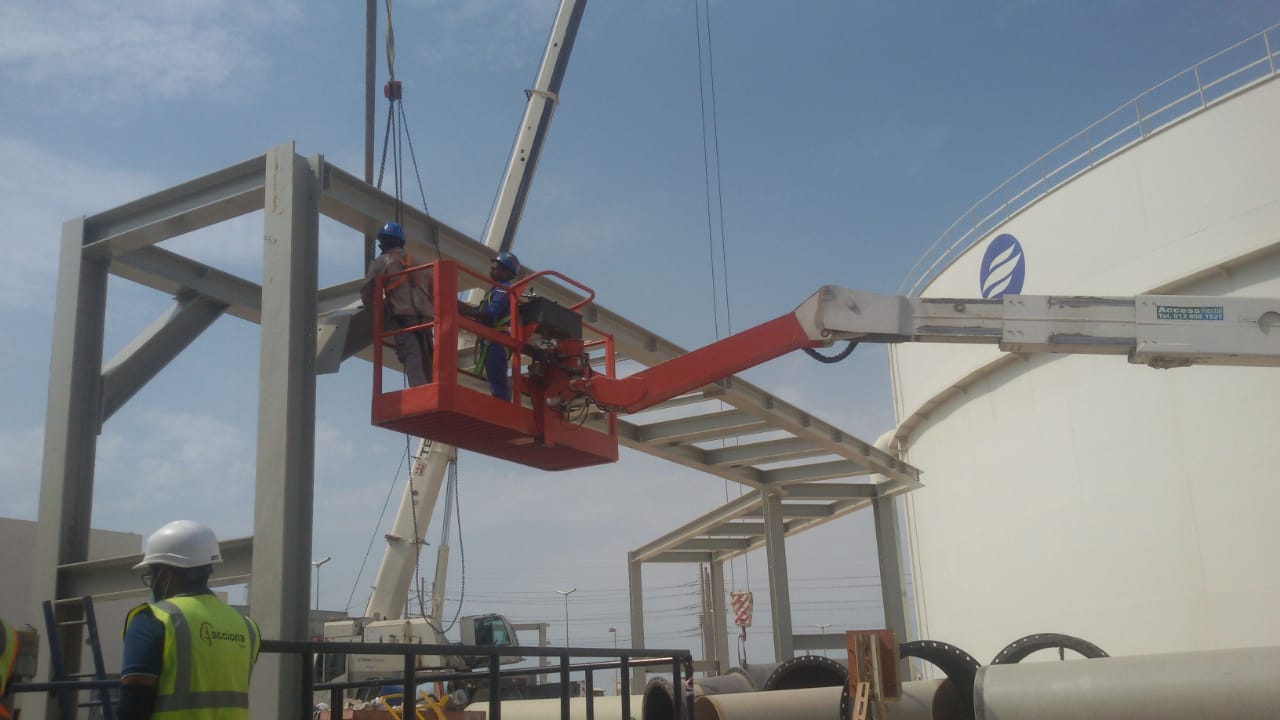 Construction workers installing steel framing at a job site
